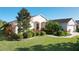 One-story home with landscaped yard and two-car garage at 27103 Camerons Run, Leesburg, FL 34748