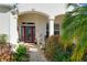 Inviting front entry with red door and brick walkway at 27103 Camerons Run, Leesburg, FL 34748