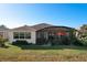 Back exterior view showing home and screened patio at 27103 Camerons Run, Leesburg, FL 34748