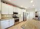 Modern kitchen with granite countertops and stainless steel appliances at 27103 Camerons Run, Leesburg, FL 34748