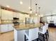 Spacious kitchen with granite countertops, stainless steel appliances, and an island at 27103 Camerons Run, Leesburg, FL 34748