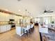 Open kitchen boasts granite island, stainless steel appliances, and ample cabinet space at 27103 Camerons Run, Leesburg, FL 34748