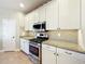 Well-equipped kitchen featuring granite counters and stainless steel appliances at 27103 Camerons Run, Leesburg, FL 34748