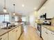Modern kitchen with granite countertops and stainless steel appliances at 27103 Camerons Run, Leesburg, FL 34748