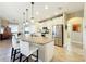 Modern kitchen with granite countertops, stainless steel appliances, and an island at 27103 Camerons Run, Leesburg, FL 34748