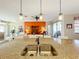 Open concept kitchen and living area with a large island and granite countertops at 27103 Camerons Run, Leesburg, FL 34748
