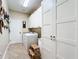 Laundry room with washer, dryer, and ample storage at 27103 Camerons Run, Leesburg, FL 34748