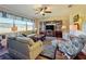 Relaxing living room with hardwood floors, comfortable seating, and built-in shelving at 27103 Camerons Run, Leesburg, FL 34748