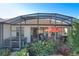 Large screened patio with hot tub and seating area at 27103 Camerons Run, Leesburg, FL 34748