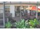 Hot tub and patio furniture on this screened patio at 27103 Camerons Run, Leesburg, FL 34748