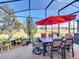 Enjoy the view from this screened patio with seating area at 27103 Camerons Run, Leesburg, FL 34748