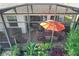 Spacious screened patio with hot tub, seating area, and dining furniture at 27103 Camerons Run, Leesburg, FL 34748