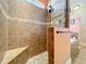 Walk-in shower with built-in seat at 27103 Camerons Run, Leesburg, FL 34748