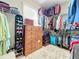 Large walk-in closet with dresser and shoe storage at 27103 Camerons Run, Leesburg, FL 34748