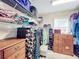 Large walk-in closet with ample shelving and drawers at 27103 Camerons Run, Leesburg, FL 34748