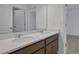 Bathroom features a double vanity with white countertop at 2833 Supermarine Rd, Tavares, FL 32778