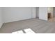 Light-filled bedroom boasts neutral carpet and white walls at 2833 Supermarine Rd, Tavares, FL 32778