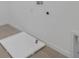 Laundry area features tile flooring and utility connections, creating a functional space at 2833 Supermarine Rd, Tavares, FL 32778