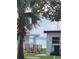 Relaxing backyard patio setup with waterfront views through mature trees at 30 Riverview Dr, Fruitland Park, FL 34731