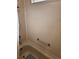 A simple white-walled bathroom with a silver towel rack and shower head at 30 Riverview Dr, Fruitland Park, FL 34731