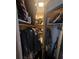 A look inside the closet featuring hanging clothes, a shelf, and some storage items at 30 Riverview Dr, Fruitland Park, FL 34731