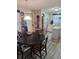 Bright dining area showcasing a round table, stainless steel refrigerator, and an island at 30 Riverview Dr, Fruitland Park, FL 34731