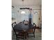 Dining room with a round table, adjacent to the home's entry at 30 Riverview Dr, Fruitland Park, FL 34731