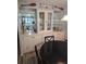 Bright dining room with a display cabinet and view of the kitchen at 30 Riverview Dr, Fruitland Park, FL 34731