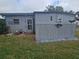 Charming home featuring well-maintained yard and unique exterior details at 30 Riverview Dr, Fruitland Park, FL 34731