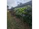 Home exterior featuring meticulous landscaping and vibrant greenery at 30 Riverview Dr, Fruitland Park, FL 34731