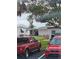 Houses with cars parked in front and a view of the lake in the background at 30 Riverview Dr, Fruitland Park, FL 34731