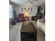Inviting living room featuring cozy seating, wood accents, and contemporary decor at 30 Riverview Dr, Fruitland Park, FL 34731