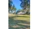 View of the back of the house with large yard at 342 Rose St, Umatilla, FL 32784