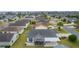 Aerial view of home with solar panels and screened porch at 3707 Gravel Ct, The Villages, FL 32163