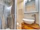 Contemporary bathroom featuring a bowl sink, wood vanity, and glass shower at 422 W 11Th Ave, Mount Dora, FL 32757