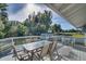 Outdoor deck with table and seating, offering scenic views of the surrounding landscape at 422 W 11Th Ave, Mount Dora, FL 32757