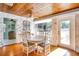 Bright dining area with wooden table and access to backyard at 422 W 11Th Ave, Mount Dora, FL 32757