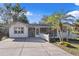 Charming bungalow exterior with landscaped yard and spacious driveway at 422 W 11Th Ave, Mount Dora, FL 32757