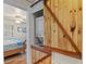 A laundry room showcases a stacked washer and dryer behind a rustic sliding barn door at 422 W 11Th Ave, Mount Dora, FL 32757