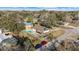 Aerial view of a home with a fenced backyard and a private swimming pool at 5640 Se 21St Ln, Ocala, FL 34480
