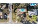 Aerial view of a home with a private backyard pool and lush greenery, providing a serene outdoor oasis at 5640 Se 21St Ln, Ocala, FL 34480