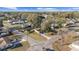 An aerial shot of the home surrounded by mature trees and neighboring houses at 5640 Se 21St Ln, Ocala, FL 34480