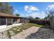 Fenced backyard with a screened-in porch, patio area, and green space at 5640 Se 21St Ln, Ocala, FL 34480