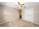 Bedroom featuring neutral walls, carpeted floor, ceiling fan, and closet at 5640 Se 21St Ln, Ocala, FL 34480