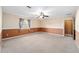 Spacious bedroom featuring neutral color palette, ceiling fan and ample natural light from window at 5640 Se 21St Ln, Ocala, FL 34480