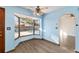 Charming eat-in kitchen area with pool view through the bay window and modern laminate flooring at 5640 Se 21St Ln, Ocala, FL 34480