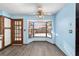 Open kitchen nook with large bay windows providing ample natural light and views to the outdoor pool at 5640 Se 21St Ln, Ocala, FL 34480