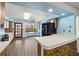 The eat-in kitchen features a center island, plenty of counter space, and large window with a view of the private pool at 5640 Se 21St Ln, Ocala, FL 34480