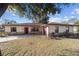 Charming single story home with stone accents, tidy landscaping, and a paved driveway at 5640 Se 21St Ln, Ocala, FL 34480