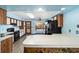 Spacious kitchen offers laminate flooring, stone accents, updated appliances, and seamless backyard access at 5640 Se 21St Ln, Ocala, FL 34480